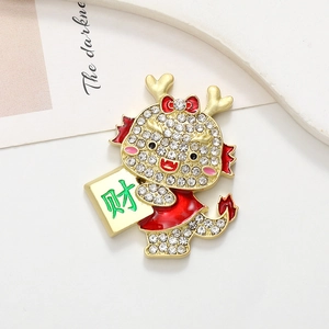 Detailed close-up of a festive dragon charm with white crystals and red enamel accents