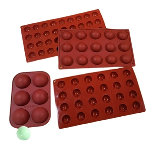 Set of 4 red semi-sphere silicone baking molds with 6, 15, and 24 holes for cake making
