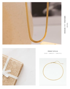 Detail view of a gold herringbone chain necklace with lobster clasp and extension link