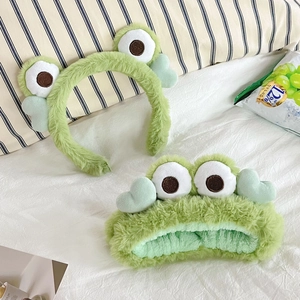 Plush green frog hairband and headband set with cute cartoon eyes and heart details