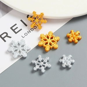 Gold and silver snowflake resin charms for DIY crafts and winter holiday decorations