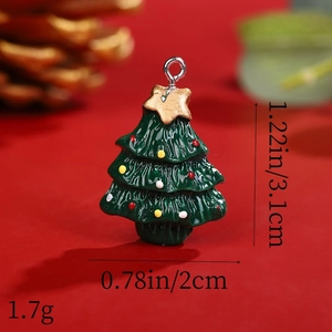 Macro view of a resin Christmas tree pendant with size and weight dimensions shown
