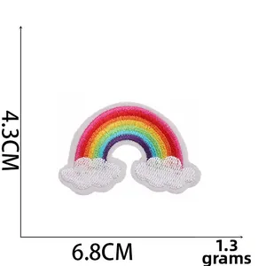 Detailed view of rainbow embroidery patch with clouds measuring 6.8cm x 4.3cm