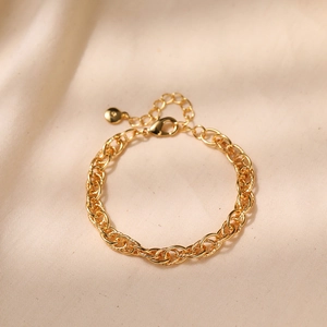 Macro shot of gold-plated brass twisted chain bracelet with lobster clasp and extension