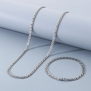 Detail of silver rectangle chain links necklace and bracelet set with lobster clasp