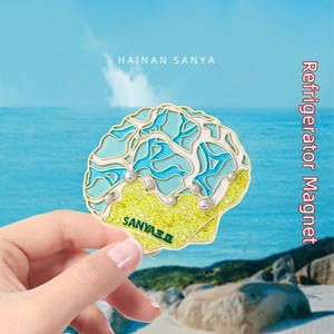 Tropical Sanya beach souvenir magnet featuring a sea shell design with pearls and palm trees