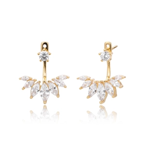 Macro detail of gold-plated ear jackets featuring fan-shaped marquise-cut white zircons