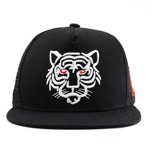 Flat brim trucker hat featuring white tiger embroidery and breathable mesh back