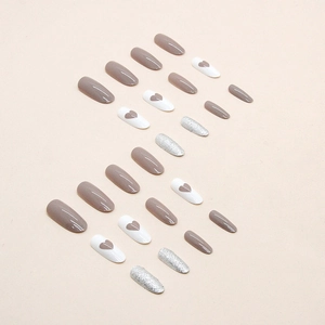 Medium-long oval press-on nails featuring coffee glitter and brown heart designs