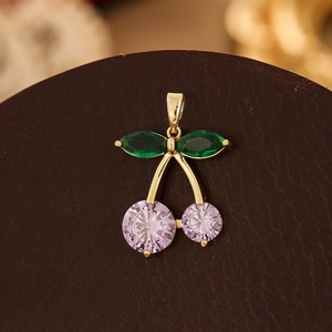Detail of cherry pendant with marquise green leaves and purple crystal stones