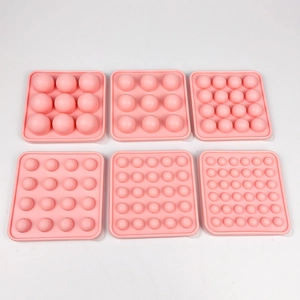 6-piece pink food-grade silicone spherical ice ball and chocolate mold set on white background