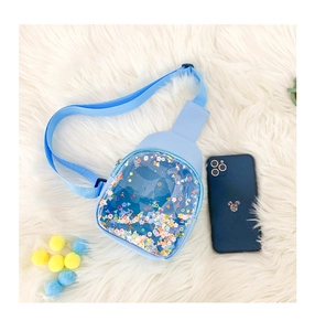 Detailed close-up of light blue kids PVC chest bag with colorful floating sequins