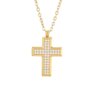 Golden titanium steel cross necklace with pavé set cubic zirconia on a white background