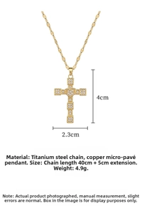 Detail of gold cross necklace with heart inlay and dimensions 4cm x 2.3cm