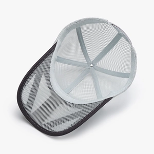 Breathable grey mesh trucker hat featuring a structured six-panel design and reinforced seams