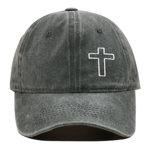 Macro detail of cross embroidery and distressed washed cotton on baseball cap