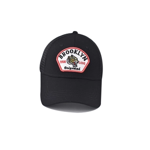 Close-up of a black baseball cap featuring tiger embroidery and Brooklyn text patch