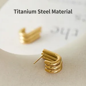 Elegant gold-plated titanium steel triple hoop earrings with a modern minimalist design