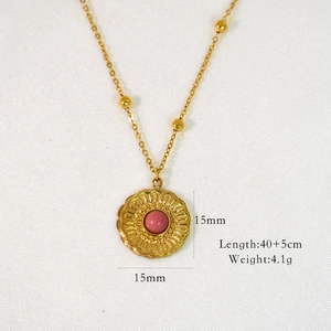 Detail showing 15mm sunburst pendant with pink stone on a 40+5cm gold chain