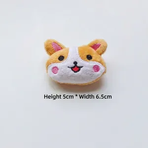 Detail of Corgi plush accessory with embroidery, 5cm height and 6.5cm width dimensions