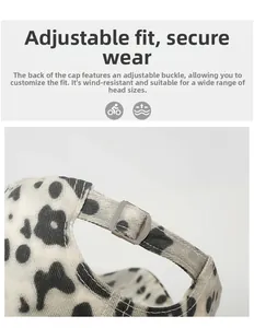Detail of adjustable metal buckle and strap on leopard print baseball cap for custom fit