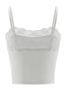 Close-up of white cropped lace bra featuring delicate floral embroidery and thin straps