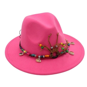 Detail of rose red felt fedora with bohemian band featuring shells and wooden beads