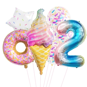 Macro shot of macaron colored ice cream donut balloons with star and number 2 decoration