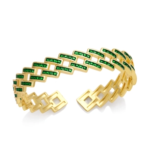 Golden geometric bangle with sparkling green zircon stones and hollow modern design