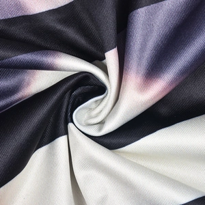 Macro detail of black and white gradient striped knit fabric with high elasticity