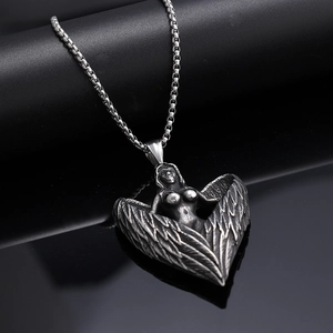 Gothic angel wing pendant necklace in vintage silver finish on dark leather