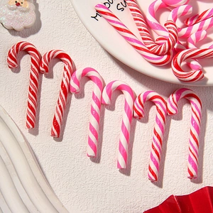 Festive red and pink striped candy cane clay charms for DIY hair accessories and crafts