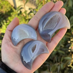 Three hand-held natural agate geode moon carvings for home decor and crystal collection