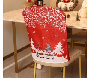 Detail of red Christmas chair cover with white snowflakes and festive gnome patterns