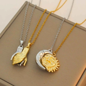 Minimalist gold and silver necklaces with interlocking hands and celestial pendants