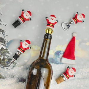 Christmas Santa Claus wine stoppers and bottle opener set on a festive snowy background