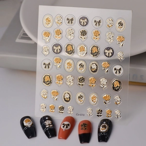 3D embossed gold and black rose nail art stickers with bow designs and metallic finish