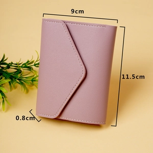 Slim pink faux leather bifold wallet with envelope flap and white stitching details