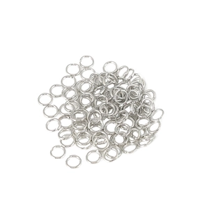 Bulk silver plated open jump rings for DIY jewelry making on white background