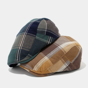 Vintage plaid newsboy cap in blue and brown colorways with classic checkered pattern