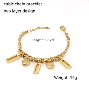 Detail of 18K gold double layer square chain bracelet with heart and rectangle charms