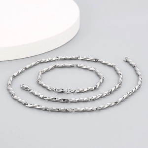 Close-up of hip hop silver stainless steel twisted link chain set with metallic luster