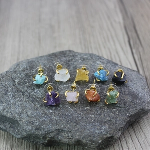 Irregular raw crystal stud earrings set with nine natural stones in gold claw settings