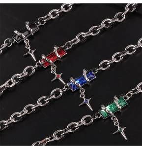 Detailed view of punk star necklaces with colorful gem pendants and silver crosses