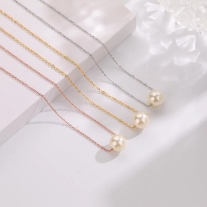 Elegant pearl pendant necklaces in silver, gold, and rose gold finishes for women