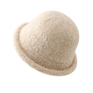 Beige plush fleece bucket hat for women with a minimalist round top and curled brim