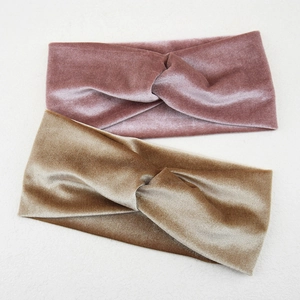 Detail of pink and champagne velvet twist headbands with soft reflective texture