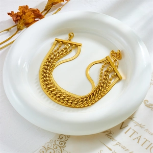 Golden multi-layer titanium steel bracelet featuring snake, bead, and Cuban link chains