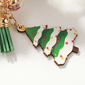 Christmas tree wooden pendant with green tassel and sequin ball on golden keychain