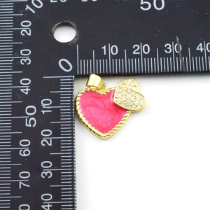 Size measurement of pink enamel heart pendant with gold frame and cubic zirconia